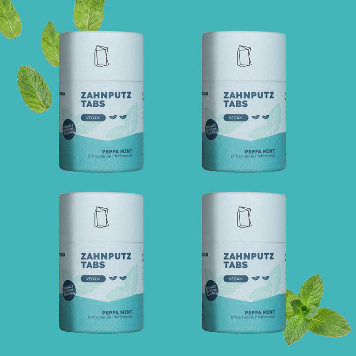 Vier Verpackungen der Zahnputztabs